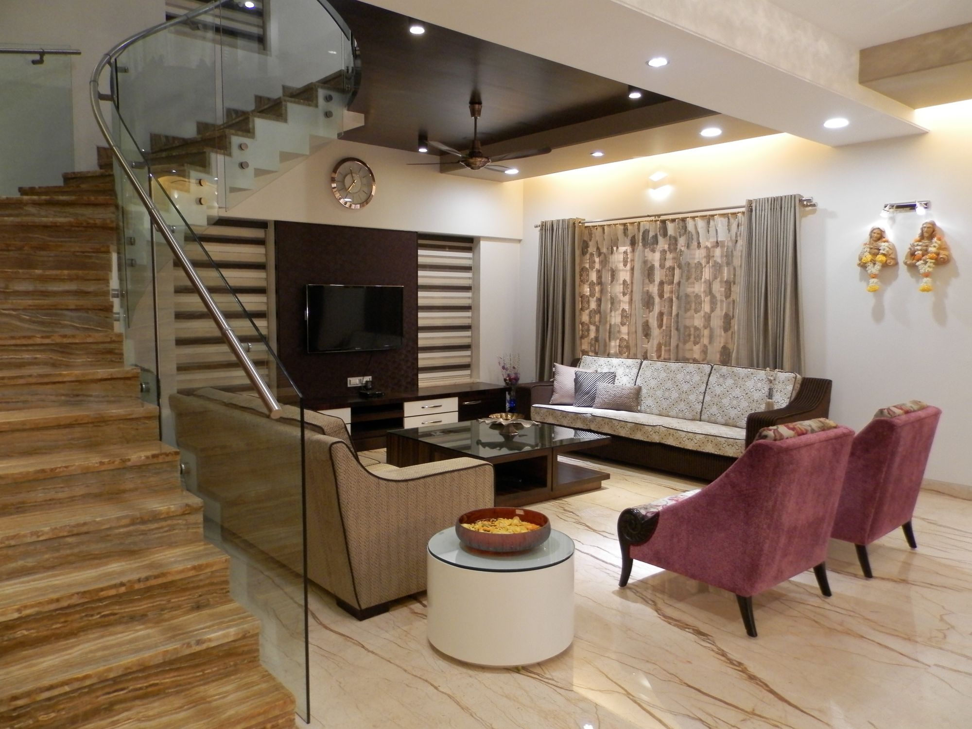 Double-height living room with a staircase