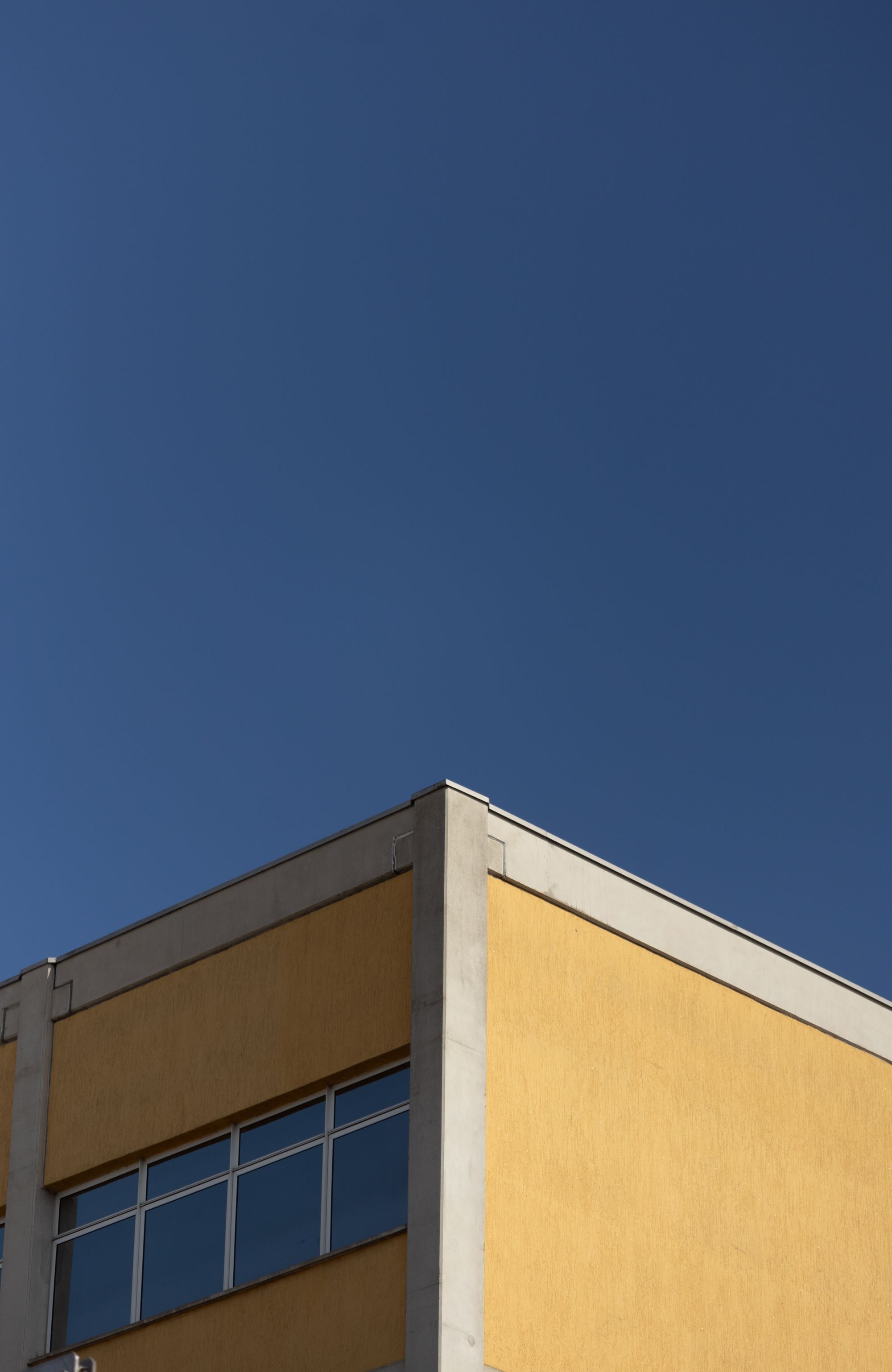 Yellow building against a blue sky
